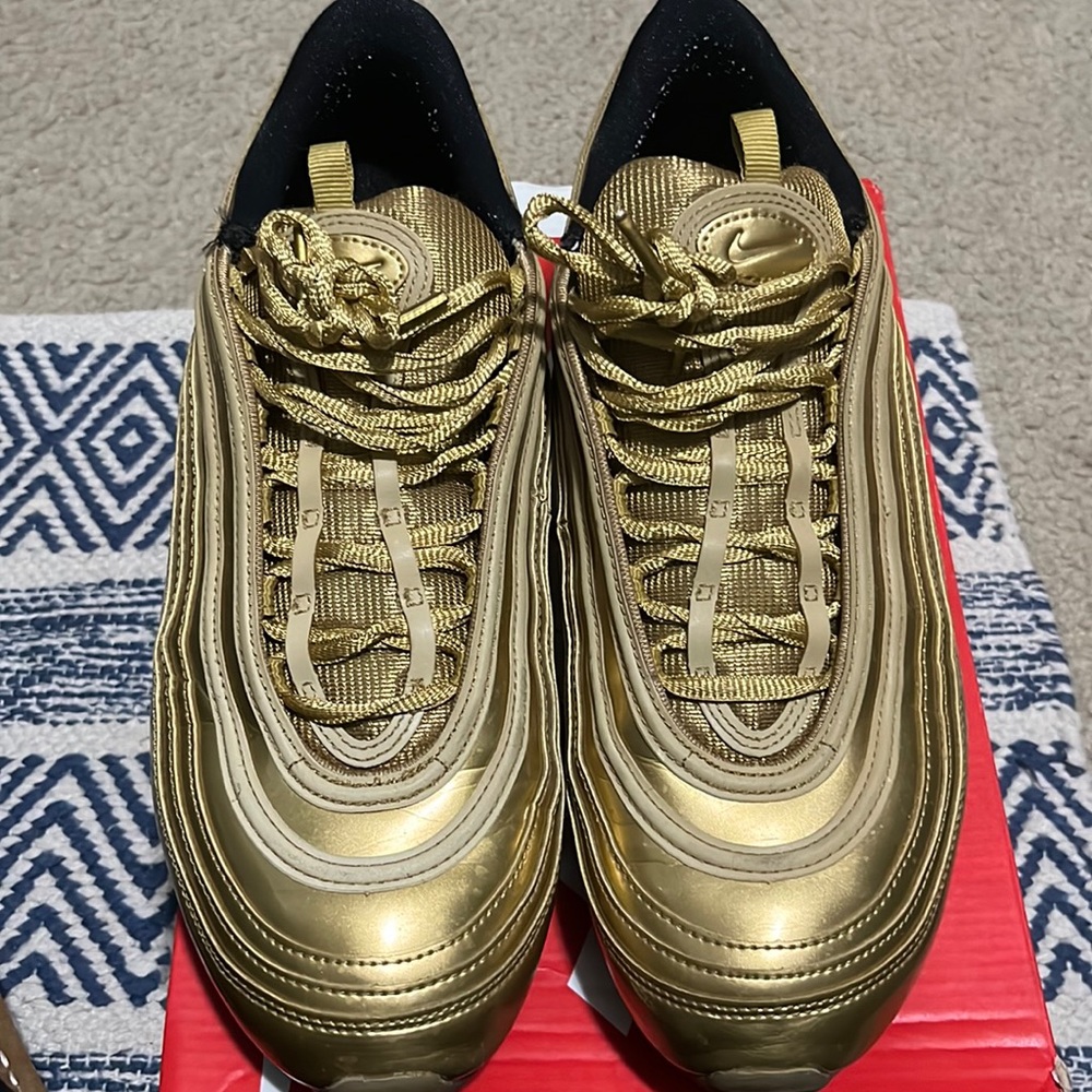 The Nike Air Max 97 Gold Medal, inspired by the Tokyo Olympics,
Mens 11.5